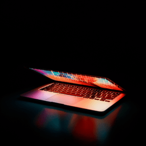 Colorful laptop with illuminated keyboard, symbolizing modern website design and digital presence for small businesses.