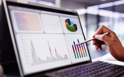 Person analyzing data on a laptop screen displaying various charts and graphs related to digital marketing performance and SEO strategies.